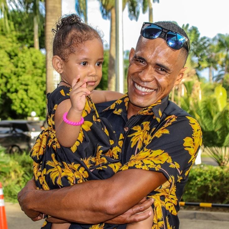 Kaveri Mehta, Lead Design Curator at Sunrise Chamber Union, reviewing corporate floral arrangements
